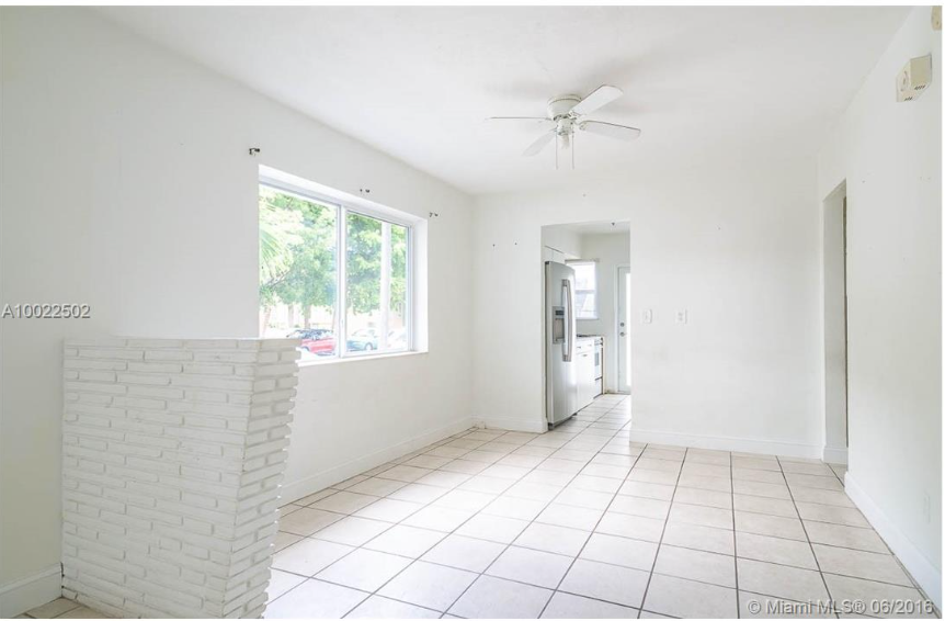 Dining area looking into kitchen at 320 86th st apt 1 - Miami Beach Condo Deal